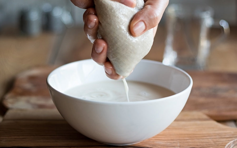 straining fruit that is softened by cooking, through a muslin bag